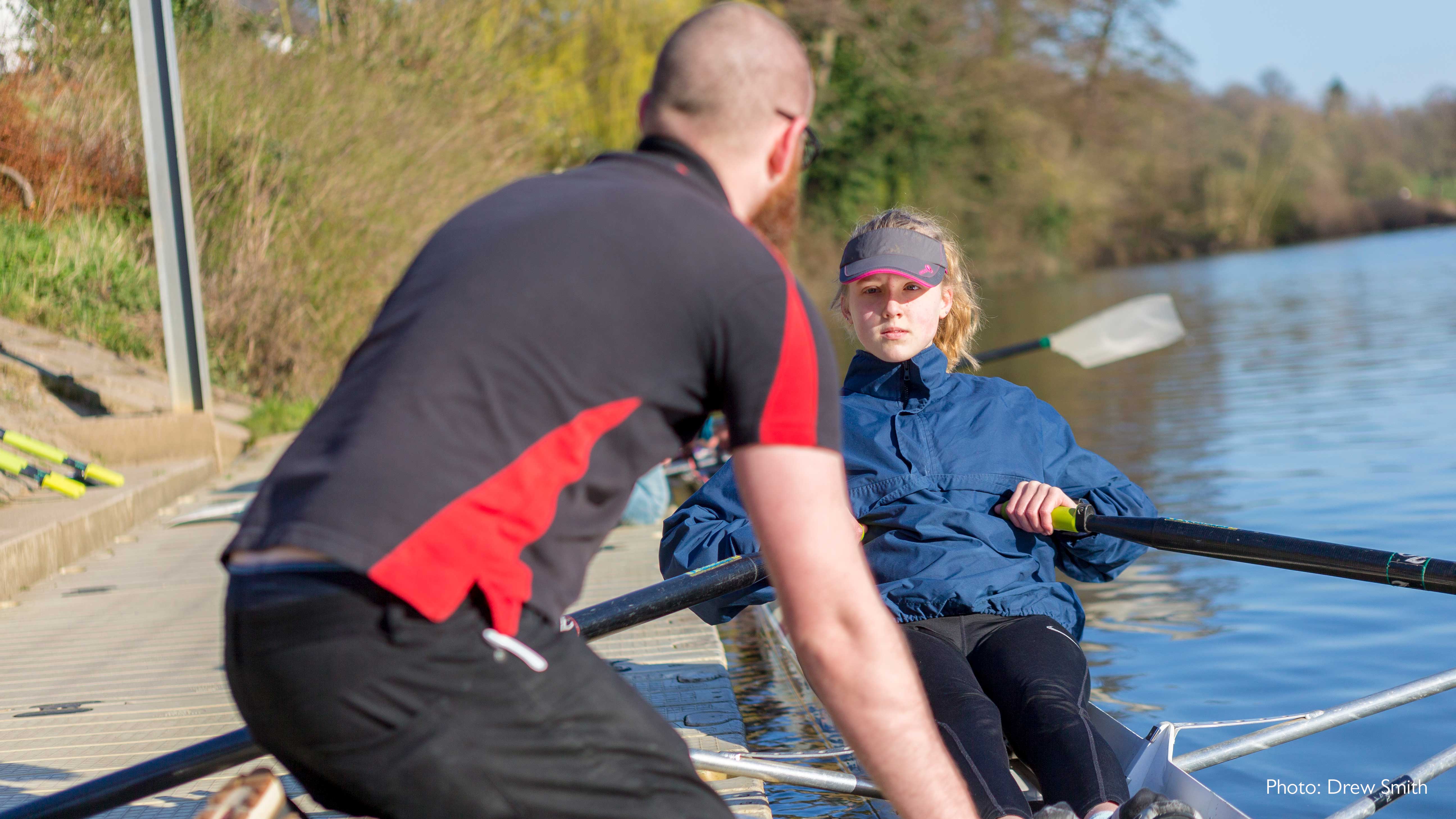 Coach with female single sculler