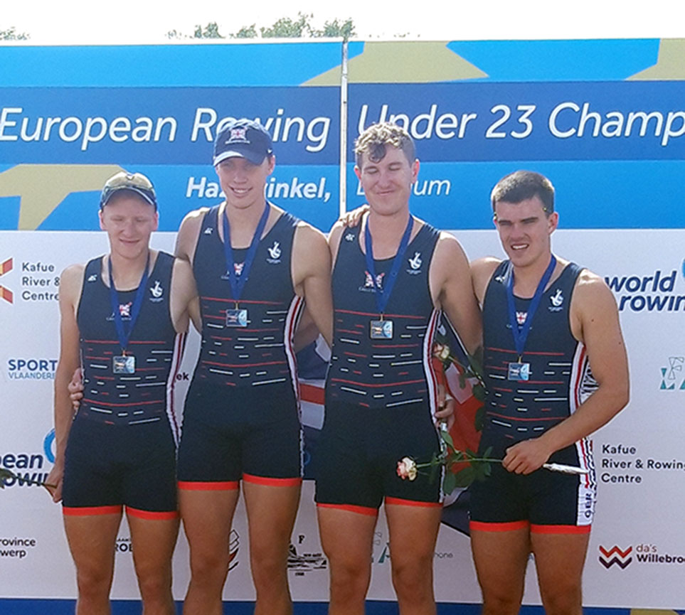 4 men with medals