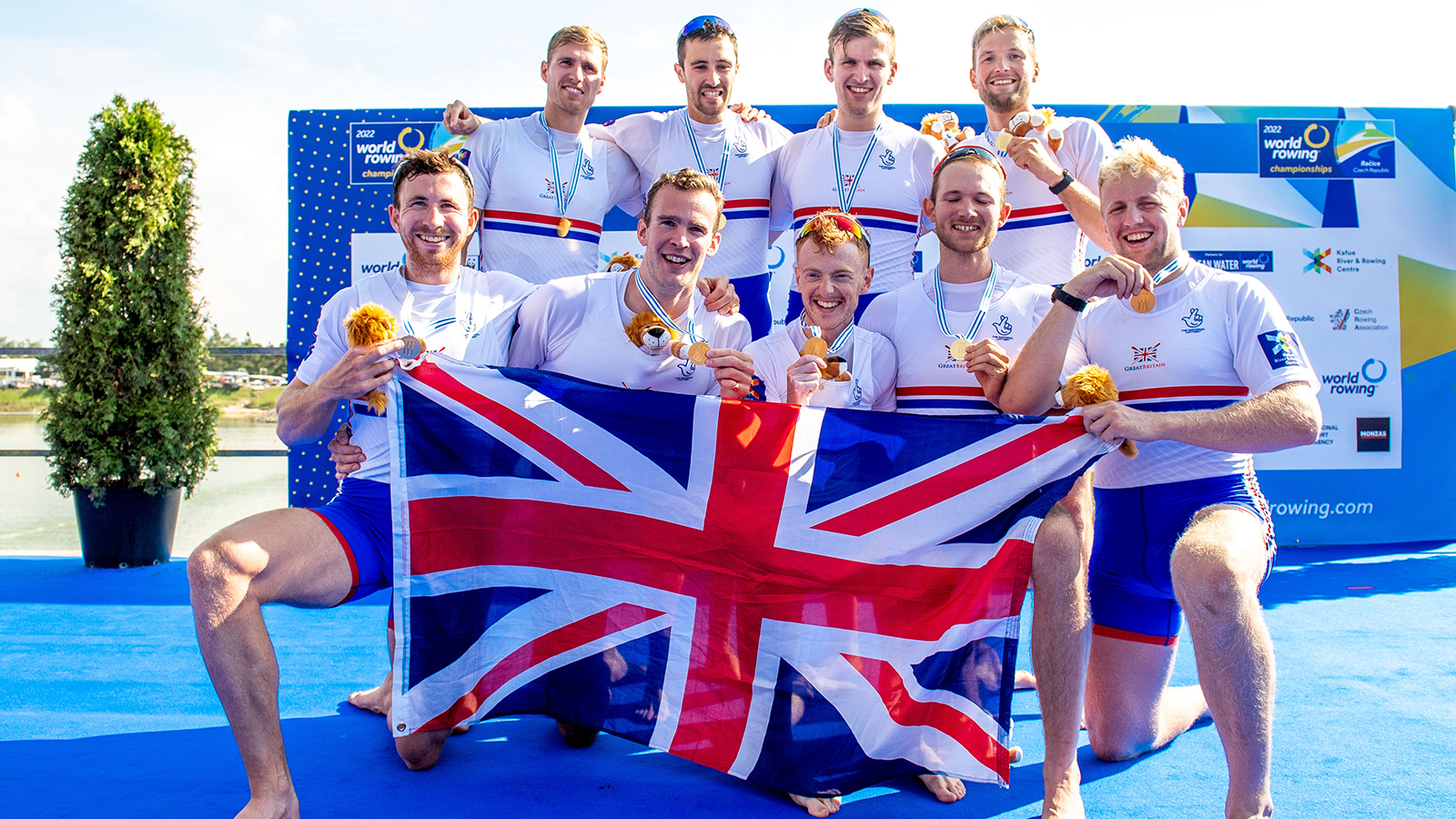 Men's eight with medals and union flag
