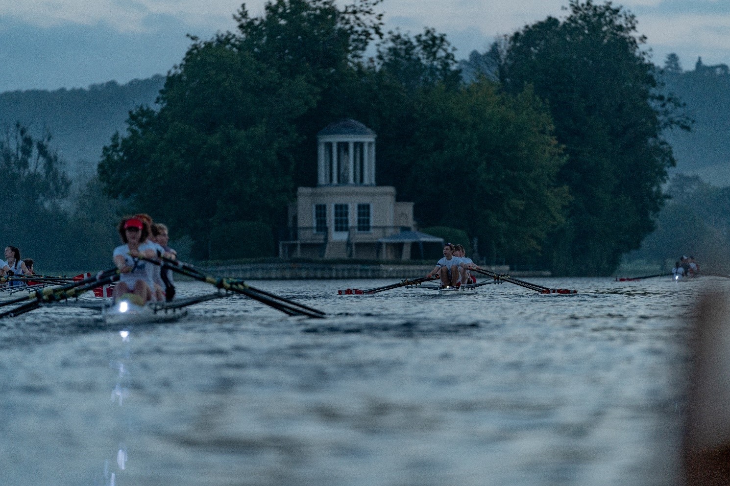 rowers in semi-darkness