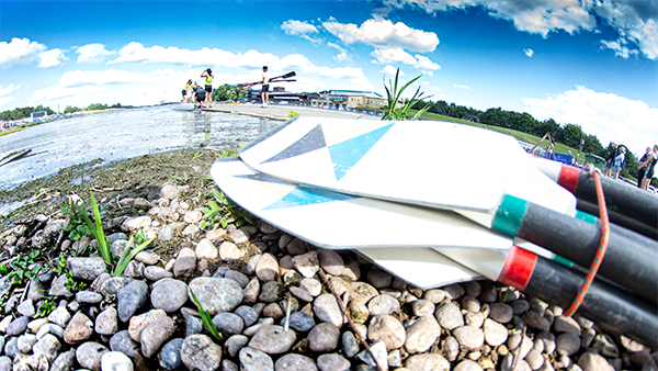 blades on pebbles by water