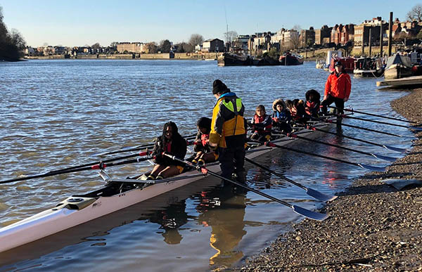 children getting into rowing boat