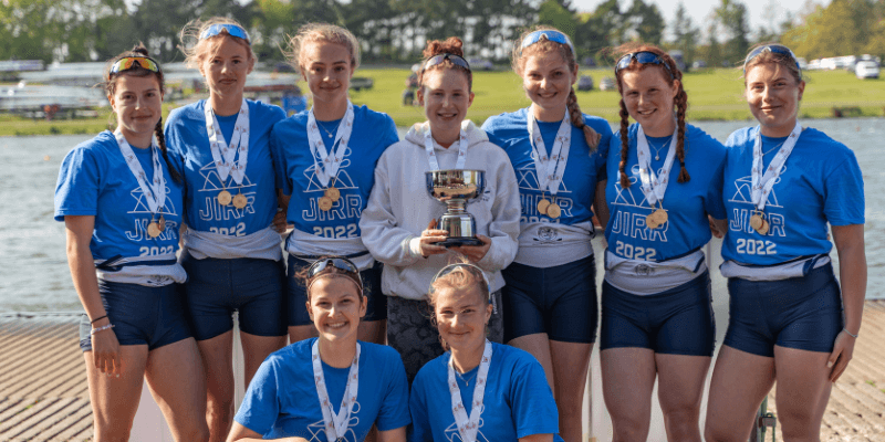 girls in blue t-shirts with medals at JIRR