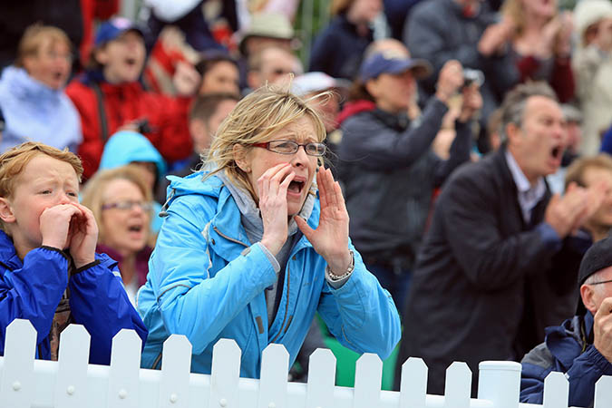 woman shouting passionately at race