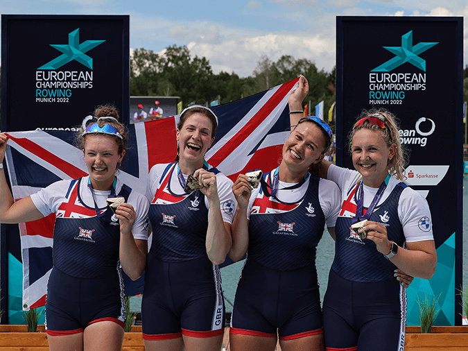 GB W4x on podium at 2022 European Rowing Championships with gold medals