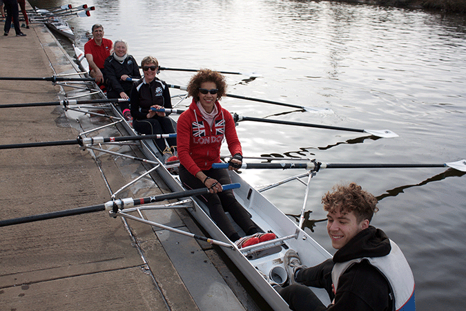 Recreational rowers in a fine coxed quad