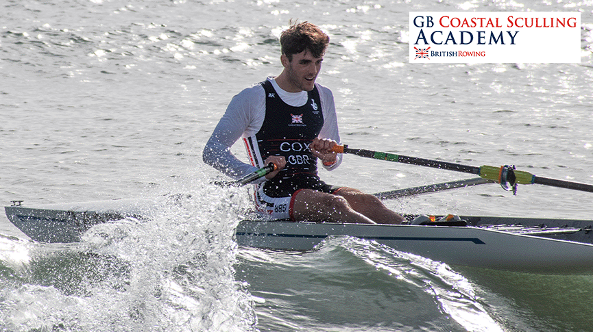 Coastal sculler with Coastal Sculling Academy logo