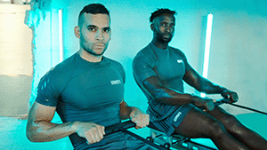 2 men on indoor rowers - azure lighting