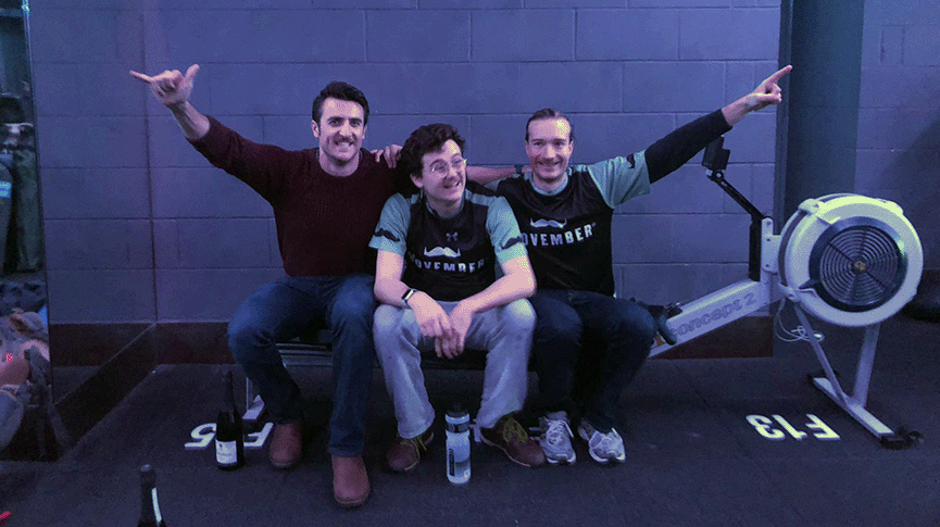 3 men in Movember shirts on ergo