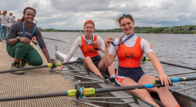 Coach with junior women's double and medals