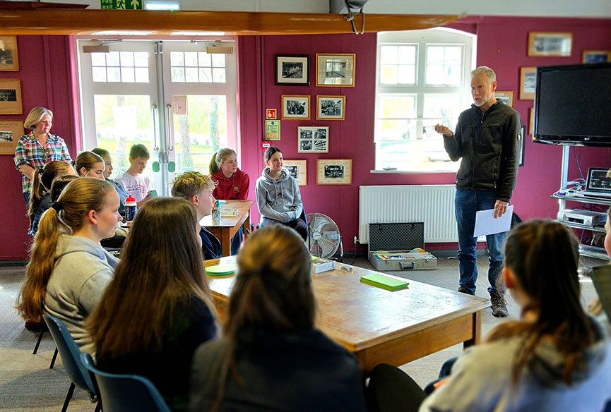 Man talking to group of juniors