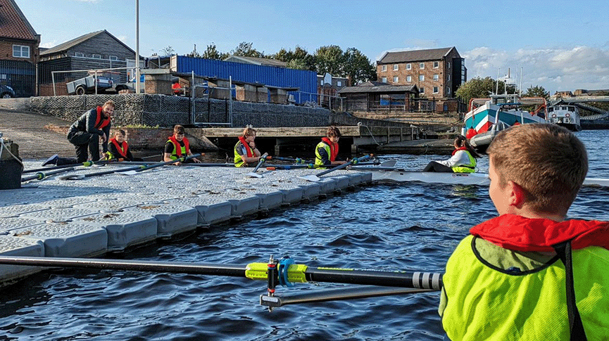 Children learning to row