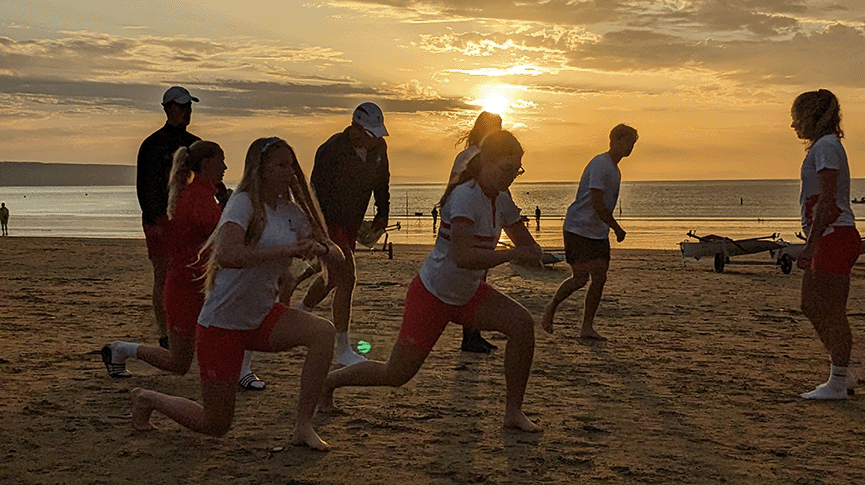 Rowers training on a beach