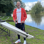 Matt Haywood in Olympic kit naming boat Matt Haywood