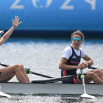 Lighweight women's double scull at Paris 2024 - bow woman with arms aloft