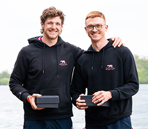 2 men with trophis in boxes