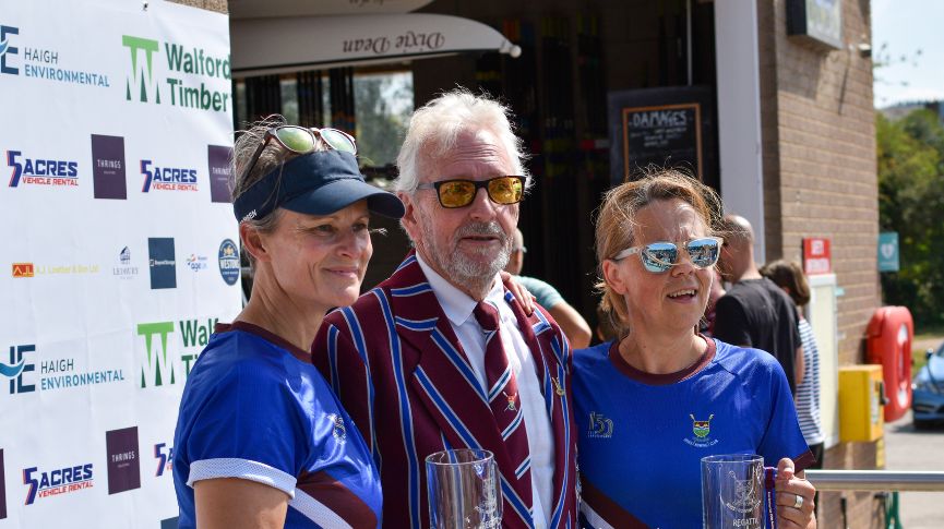 Two winners and the prize giver at Ross Regatta
