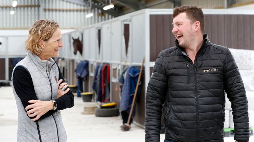 Annamarie Phelps in conversation in a stable