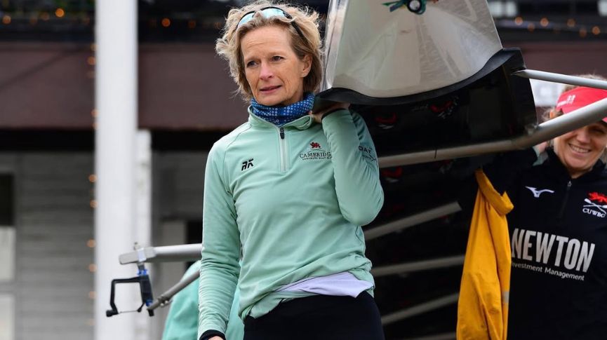 Annamarie Phelps carrying a boat