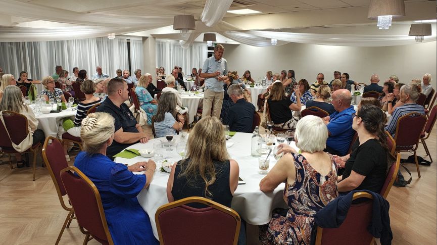 The British Rowing Tour dinner with round tables of rowers