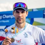 Graeme Thomas posing with a medal