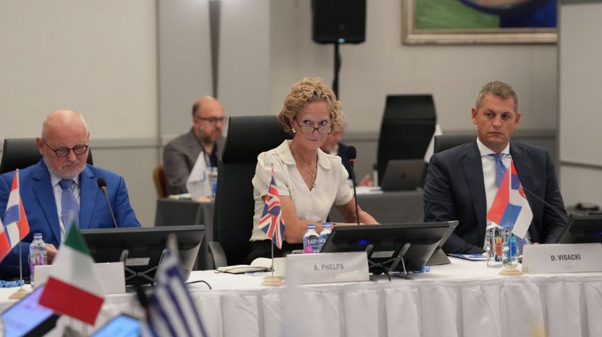 Annamarie Phelps sitting at at table at a conference