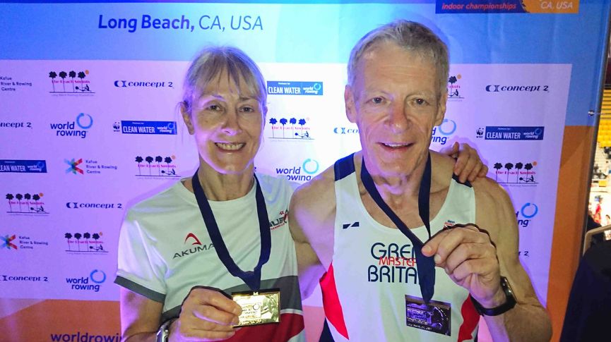 Rod Chinn and Carol Woodward holding medals at the world champs