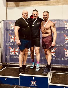 matthew on the podium at BRIC with two others