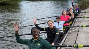 The women of northwich waving on the pontoon in a boat