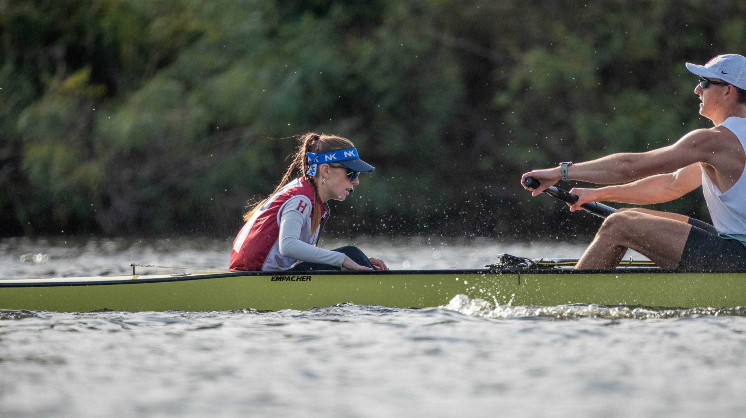 Nat Toms in the coxing seat of the Harvard Varsity Eight pictured with her strokeman mid race